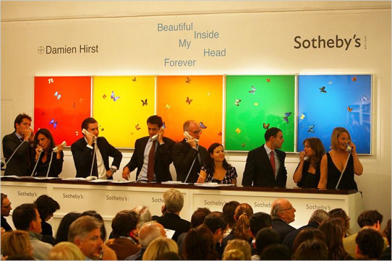 Auctioneers at work in London on Monday at the Sotheby’s auction of Damien Hirst works © Credit Daniel Berehulak/Getty Images